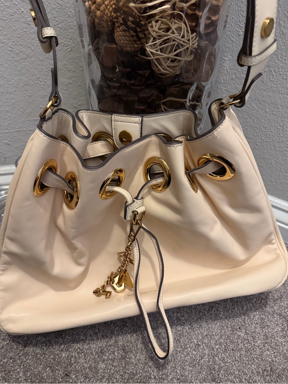 Karl Lagerfeld Cream Shoulder Drawstring Bag with Gold Hardware
